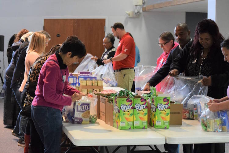 The United Way at work before the coronavirus hit. This is from the Faithfully United event in 2018, where multiple faith groups gathered to build food kits
