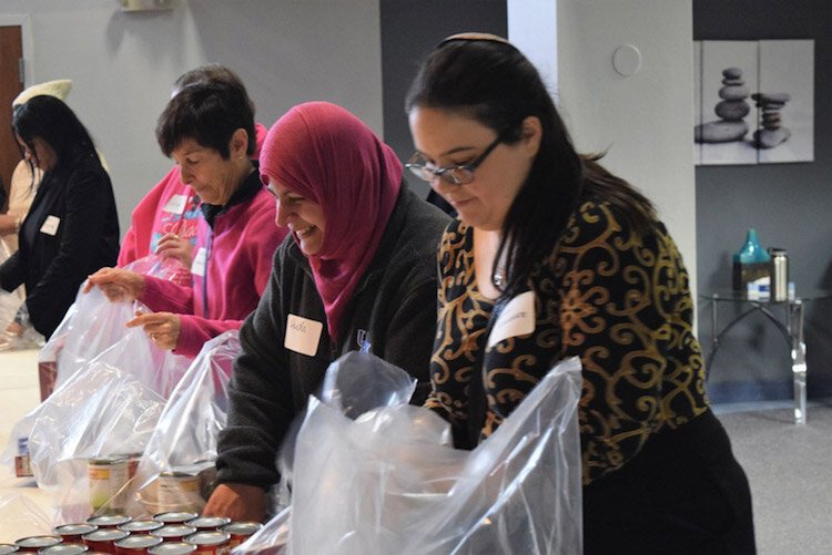 Volunteers help in a local food pantry.