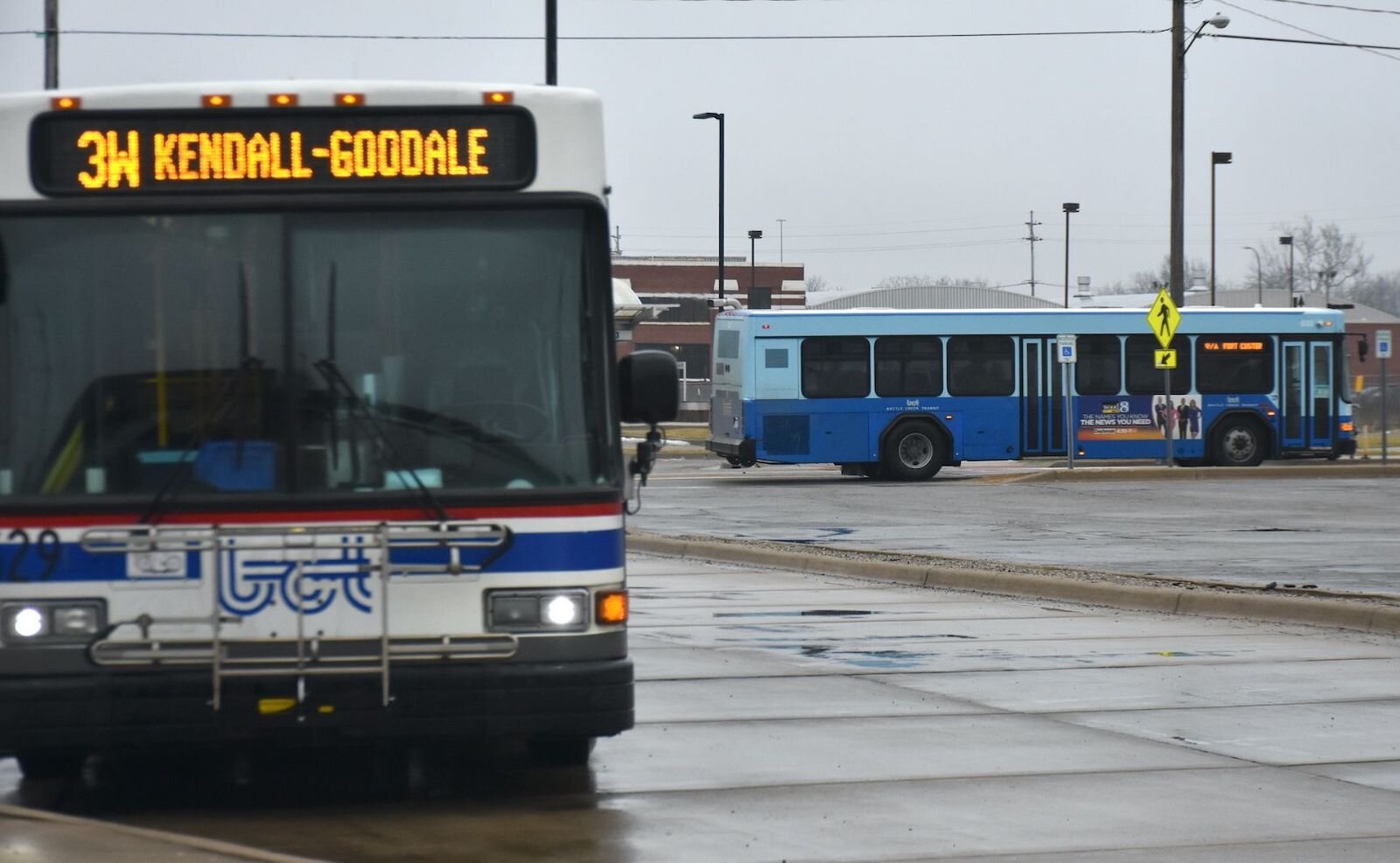 Battle Creek city buses at the downtown terminal. Bus schedules have been adjusted as bus drivers become sick with COVID.