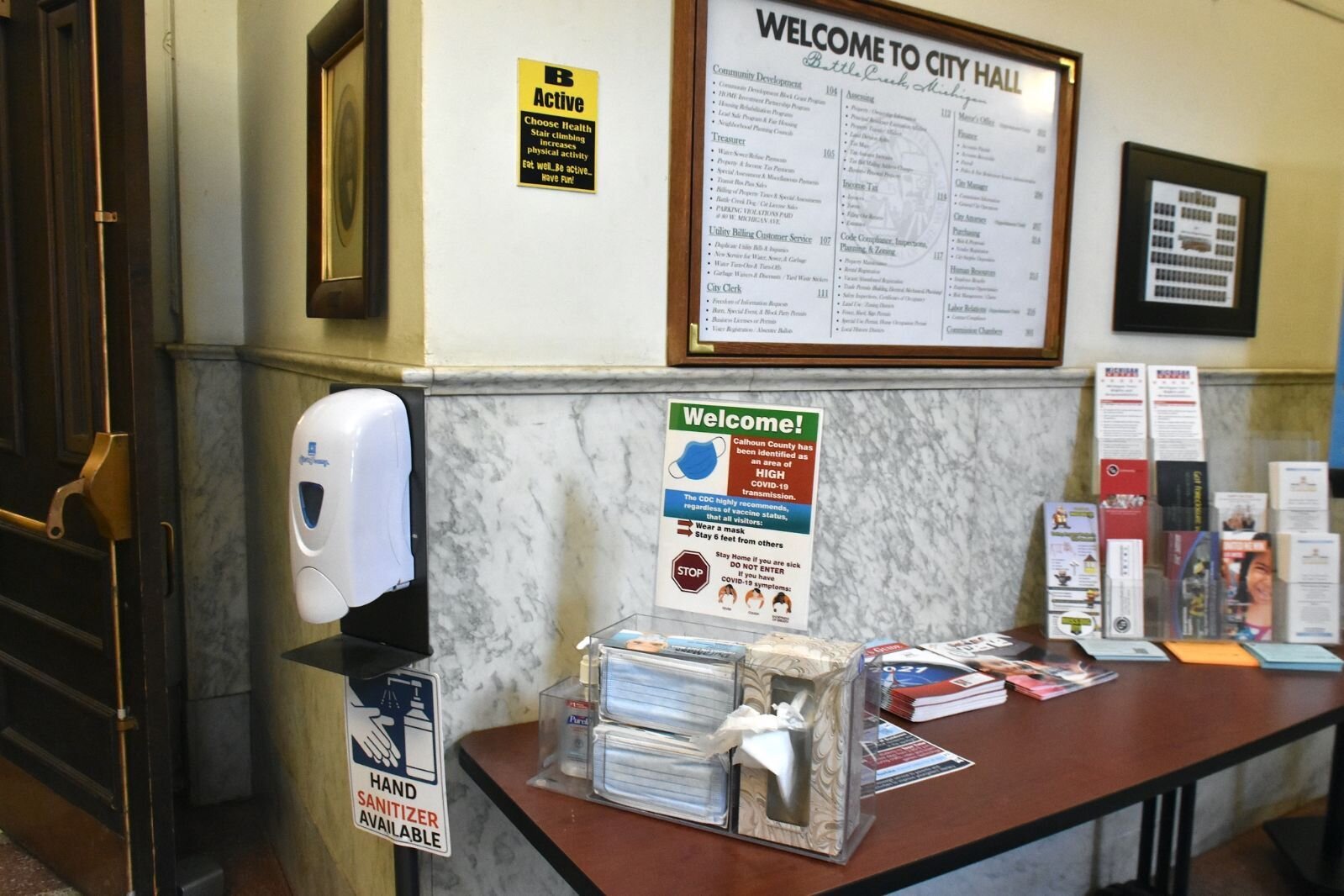 Masks and hand sanitizer are available at the public entrance to Battle Creek’s City Hall.