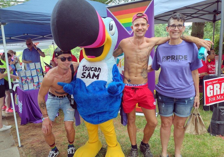 Former BC Pride volunteers James Silva, Jordan Champion, and Co-President Deana Spencer.