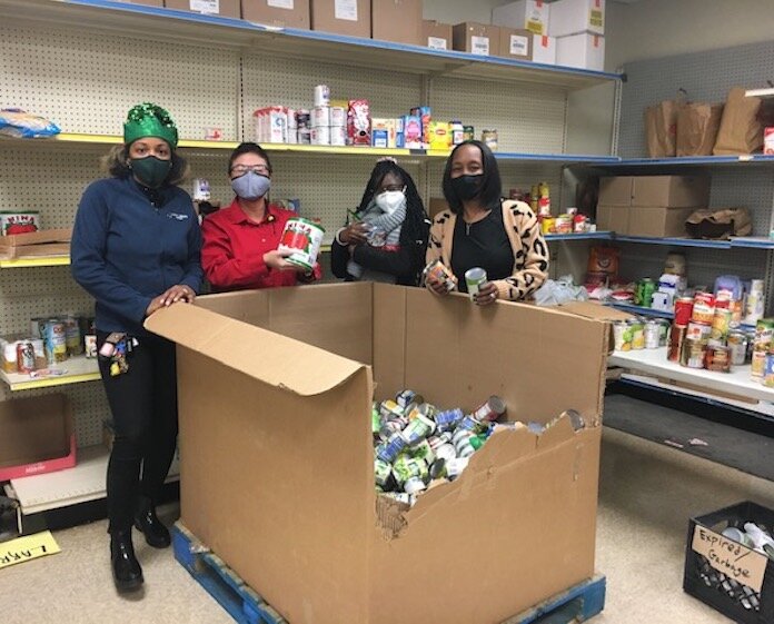 Family Health Center staff volunteer at Loaves and Fishes food bank as part of 50 Acts of Kindness for 2021.