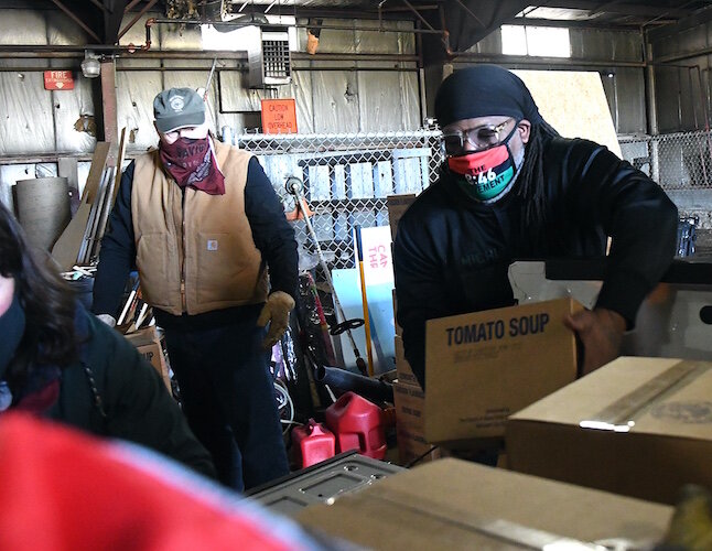 On Wednesday morning volunteers from churches throughout Battle Creek, including the Church of Jesus Christ of Latter-Day Saints, New Level Sports Ministries, unloaded and stacked a truckload of donated food for distribution over the coming weekend.