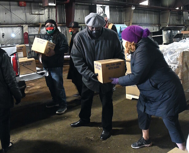On Wednesday morning volunteers from churches throughout Battle Creek, including the Church of Jesus Christ of Latter-Day Saints, New Level Sports Ministries, unloaded and stacked a truckload of donated food for distribution over the coming weekend.