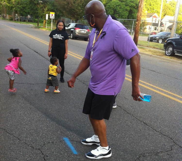 There was dancing in the street as Northside neighbors rallied behind local property owners whose houses burned recently.