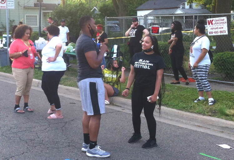 Marshall Kilgore (KPS School Board Candidate) and Chiante Lymon. There was dancing in the street as Northside neighbors rallied behind local property owners whose houses burned recently.