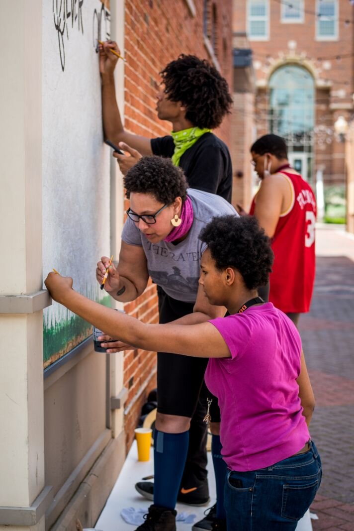 Artists converged on downtown Kalamazoo Saturday and Sunday to turn boarded up storefronts into art spaces.