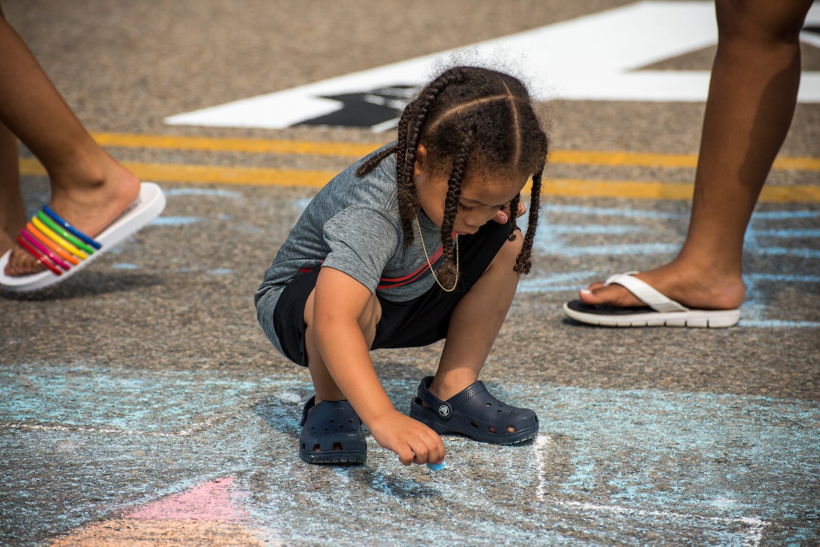 Chalk was the preferred medium for some young artists at the creation of the Black Lives Matter mural on Rose Street, between Lovell and South streets  on Friday afternoon.