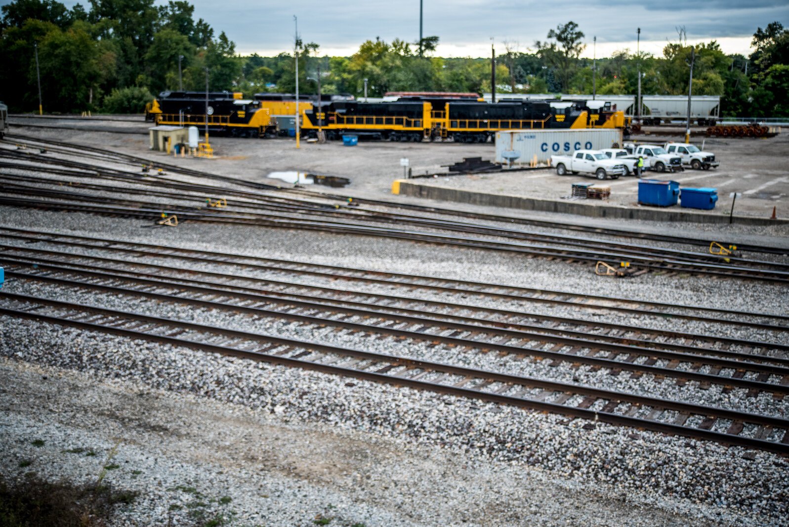 The railroad tracks are right behind the building.