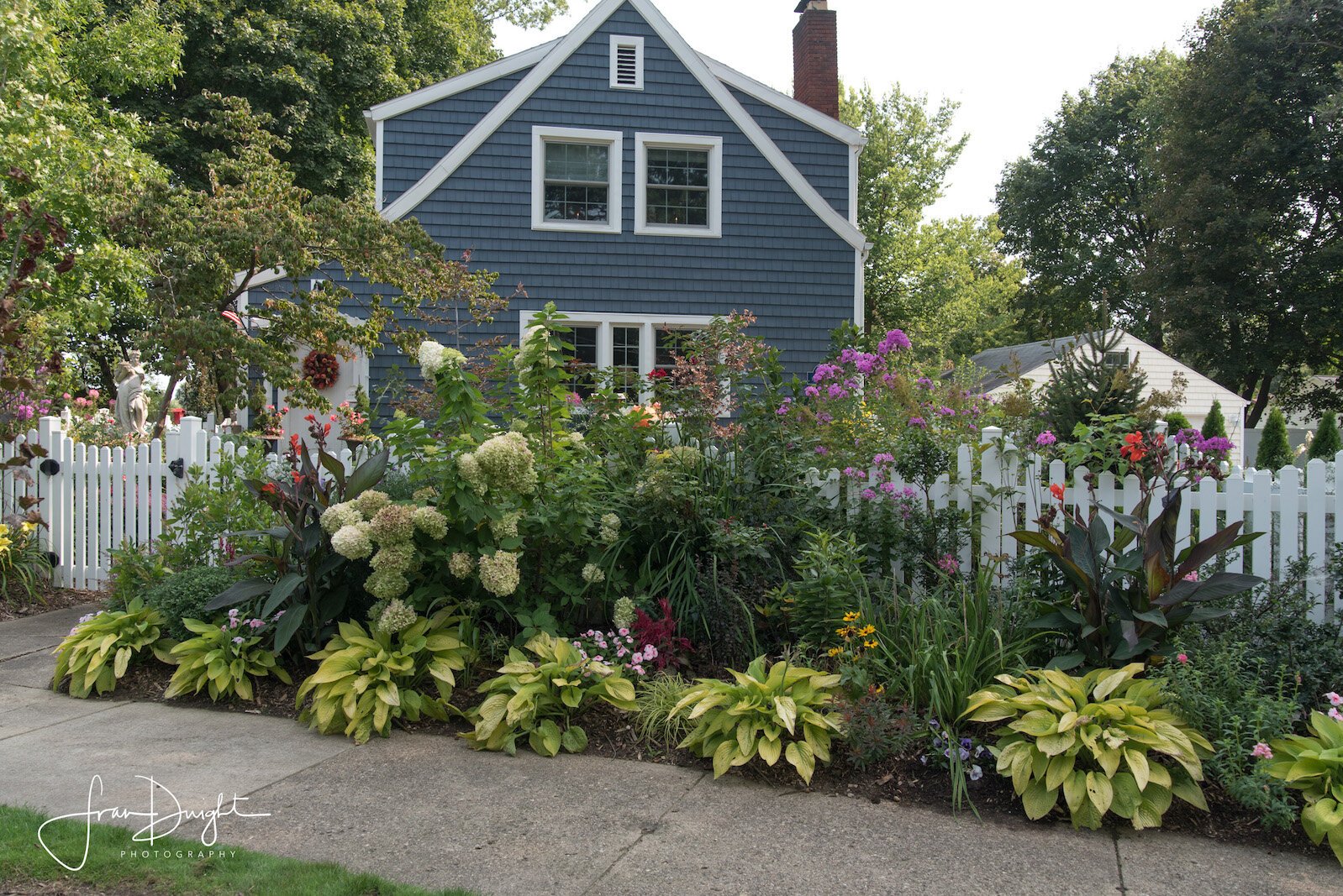 Gardens with a Victorian-style adorn the home of Scott Stokes and Curtis Whitaker in Milwood.