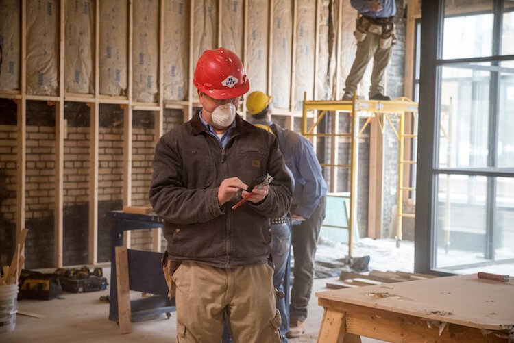 KPEP building trades instructor Tim Thornton, works among a crew of the program’s building trades students. 