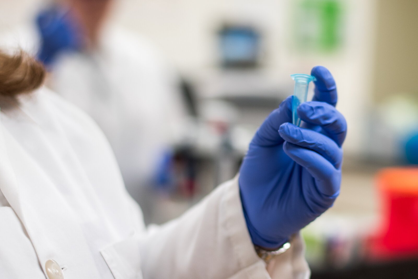 Stephanie Wheeler, clinical testing specialist at Genemarkers in Kalamazoo, displays a sample tube in one of the business’s lab rooms. Lab workers use the tubes to separate and clean DNA samples in preparation for a genetic testing process.