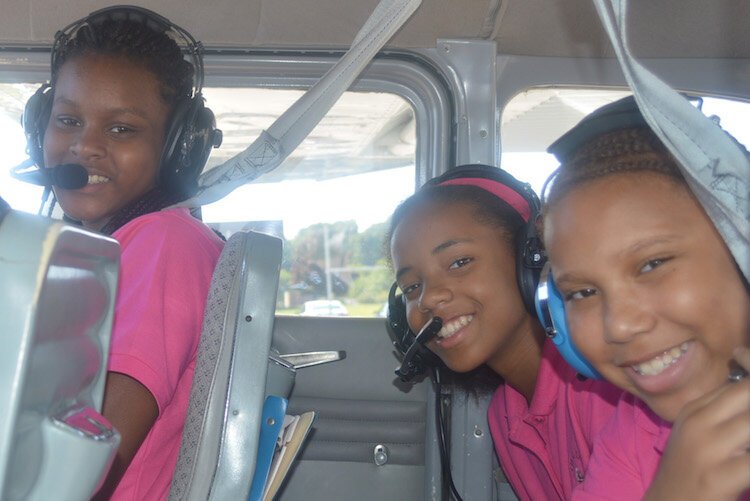 Merze Tate explorers on a plane ride