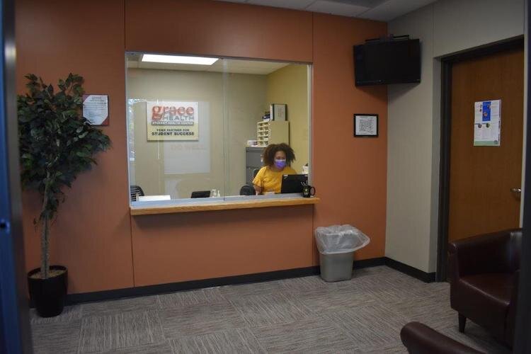 A receptionist at an in school clinic where students get help with physical and mental health concerns.