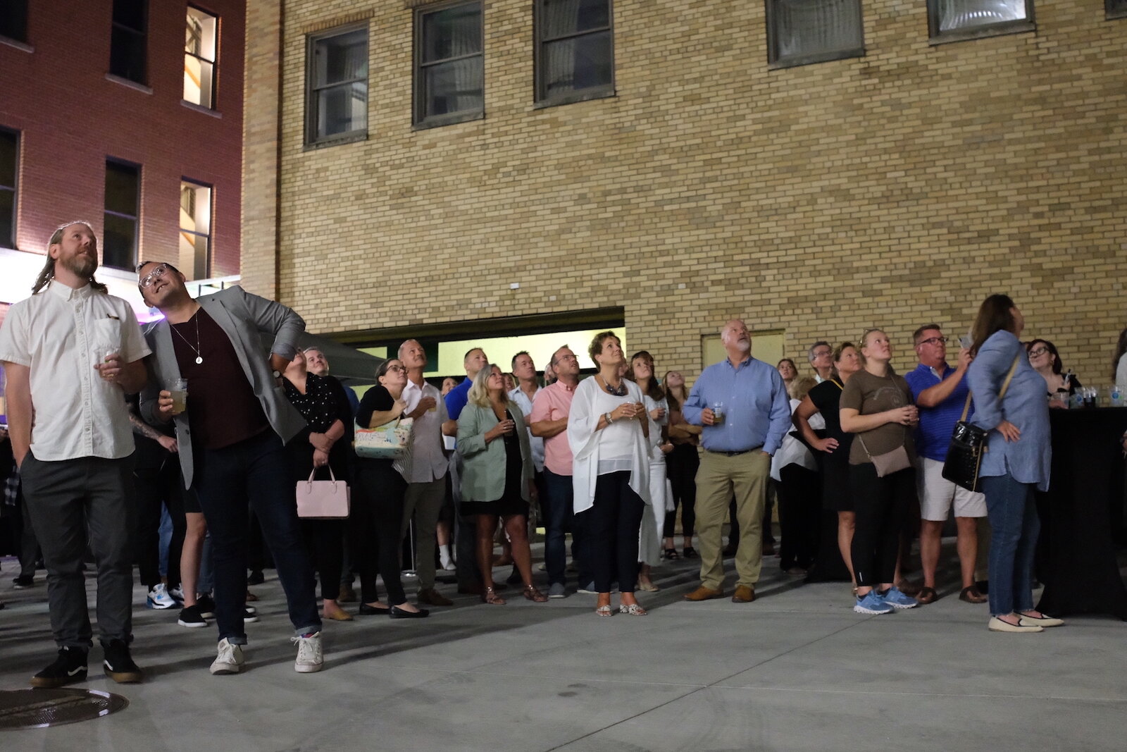 Attendees of the dedication event gather to watch the 3D projection light show. 