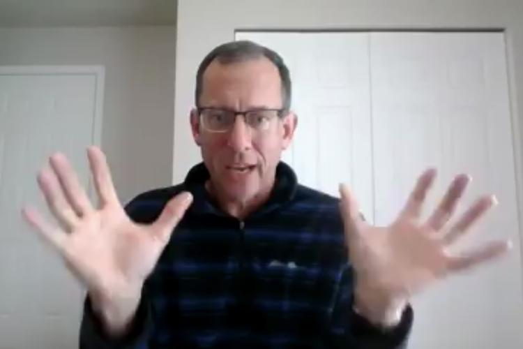 Leander Rabe is shown in this screenshot as he updates members of the Kalamazoo Coalition for the Homeless and others on the progress the organization is making.
