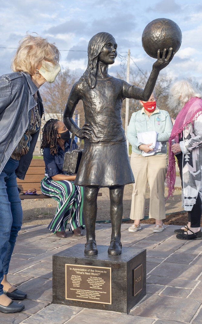 Getting a closer look at "Hope."  The statue was commissioned to mark the 100th anniversary of the Battle Creek branch of the American Association of University Women.
