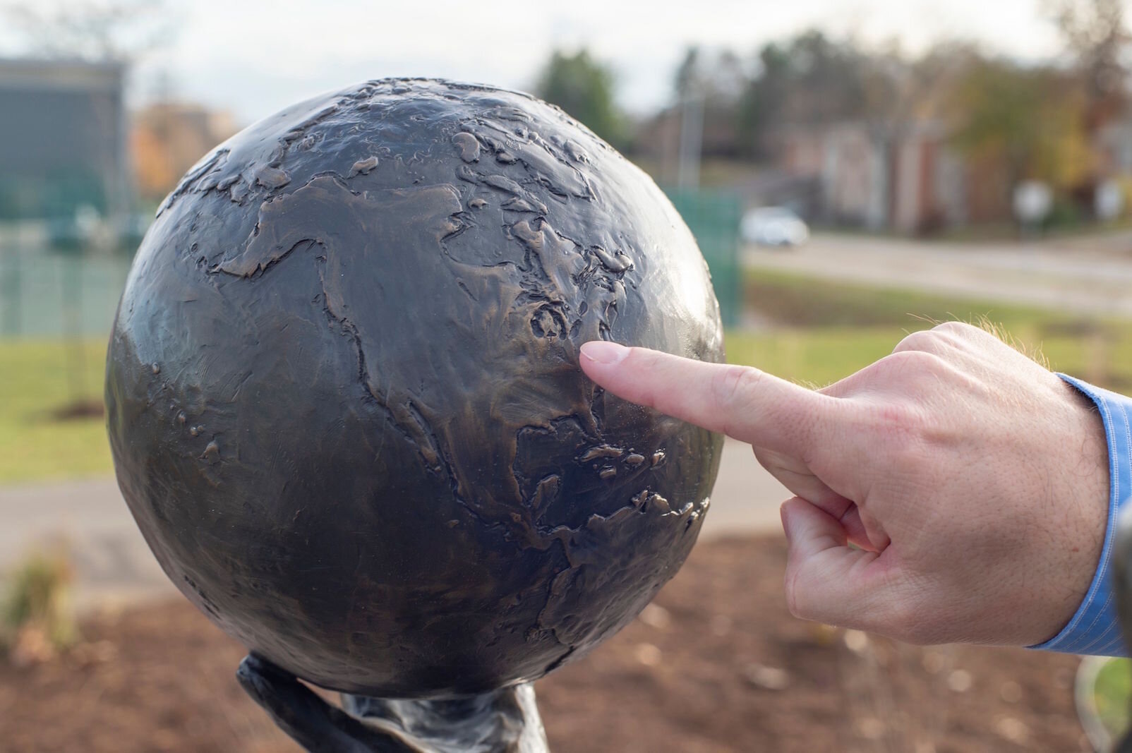 A closer look at the globe held by "Hope."