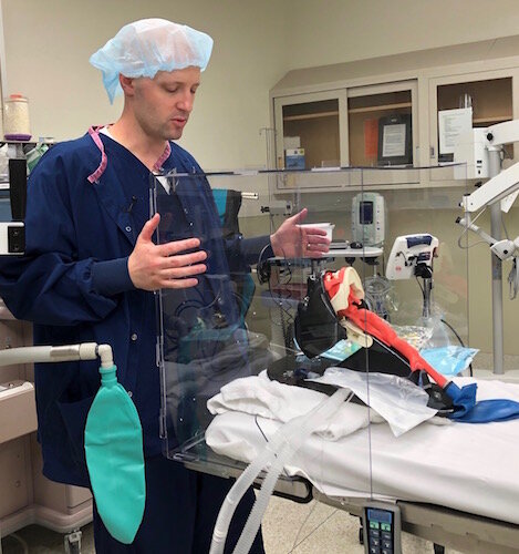 Kalamazoo nurse anesthetist Brady Beauchamp shows the Aero-Guard intubation box.