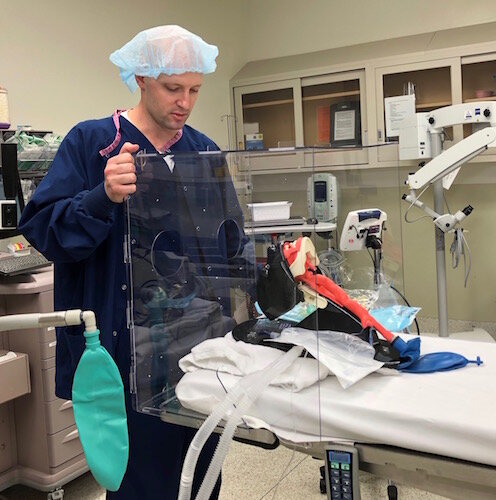 Kalamazoo nurse anesthetist Brady Beauchamp shows the Aero-Guard intubation box.