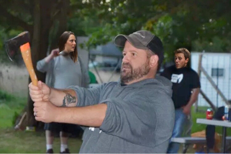 Jeremy Andrews prepares to throw an ax.