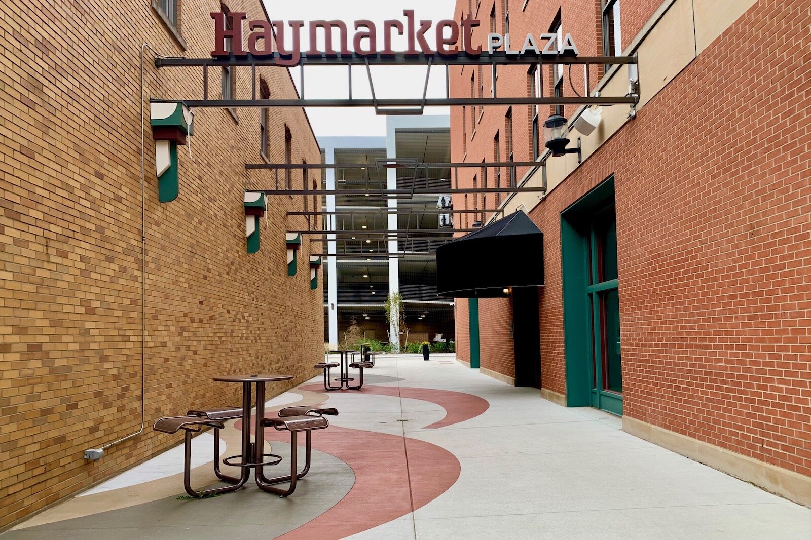 Haymarket Plaza includes about 7,000 square feet of space between the new Warner Building, at left, and the Main Street East Building, at right.
