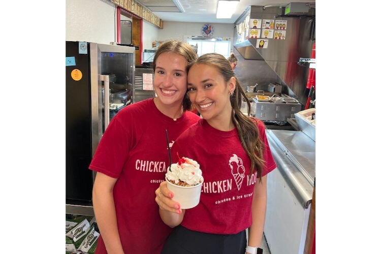 Two employees with a delectable treat!