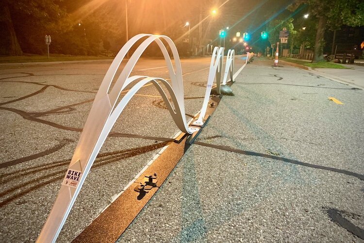 Young people who gathered for the recent Imagine Your Neighborhood Youth Summit liked the idea that work is being done to safeguard cyclists from motorists as requested in the neighborhood plan of Vine area residents. Shown here are temporary bike “w