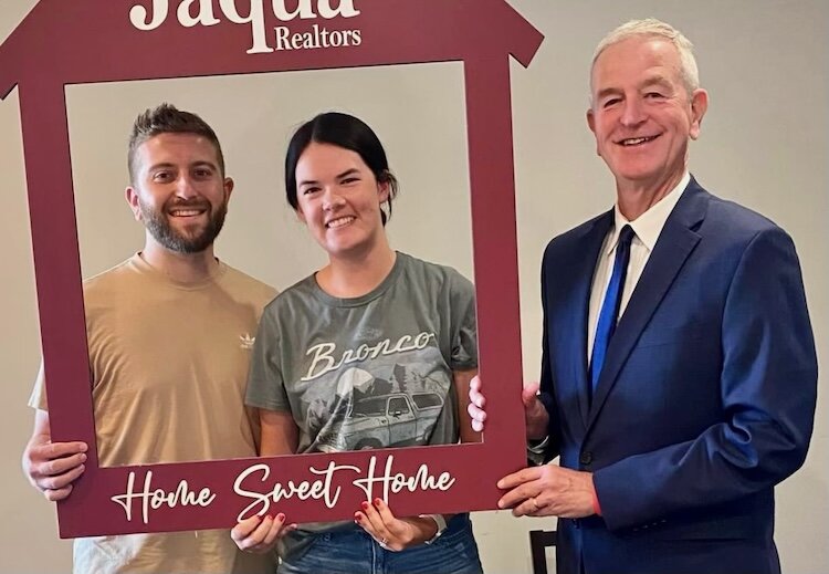 Realtor Jim Hess, right, says people are finding homes that are affordable at their income levels. They have included Drew and Shelby Novetsky.