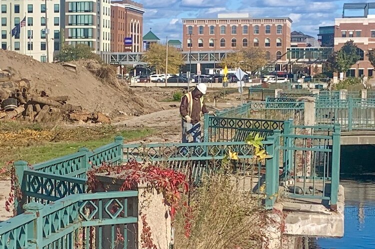 A worker looks over the site that will be home to the $300 million Kalamazoo Event Center in downtown Kalamazoo.