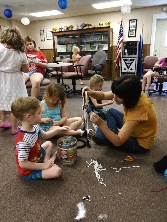 As part of Oakwood’s Youth Summer Arts Program children play on the floor of the community room inside the Oakwood Neighborhood Association Community & Youth Center. The program provides a creative outlet for children for six weeks each summer.