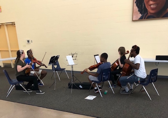 The Helen Fox Gospel Music String ensemble performed recently with their teacher, cellist Jordan Hamilton, at the Douglass Community Association's community room.