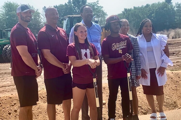 Varsity softball player London Rabb, holding shovel at left, and varsity baseball player Devon Webster, holding shovel at right, are among the many Kalamazoo Central High School student expected to benefit from new ball fields.