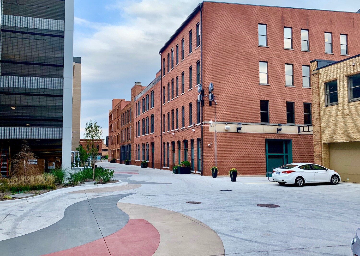 In this picture of Haymarket Plaza looking east: To the left is the rear of the new Warner Building. To the right is the rear of the Main Street East Building.