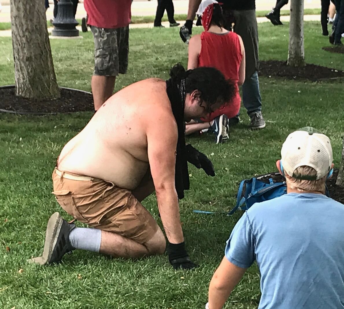 A man is overcome by pepper spray at Saturdays counter protest at Arcadia Creek Festival Place.