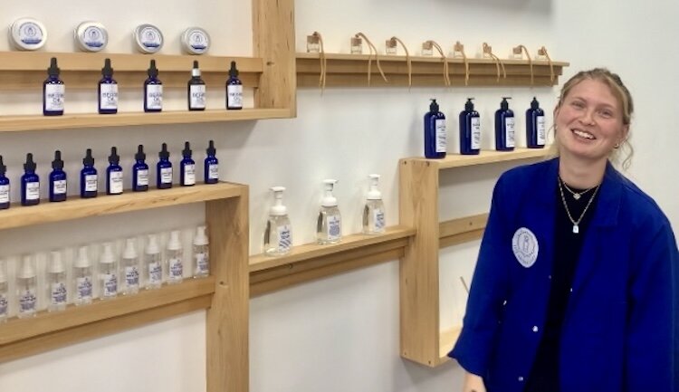 Julia Labadie, an “Aromatender” at The Aroma Labs, shows a range of products that can be produced from the scents. 
