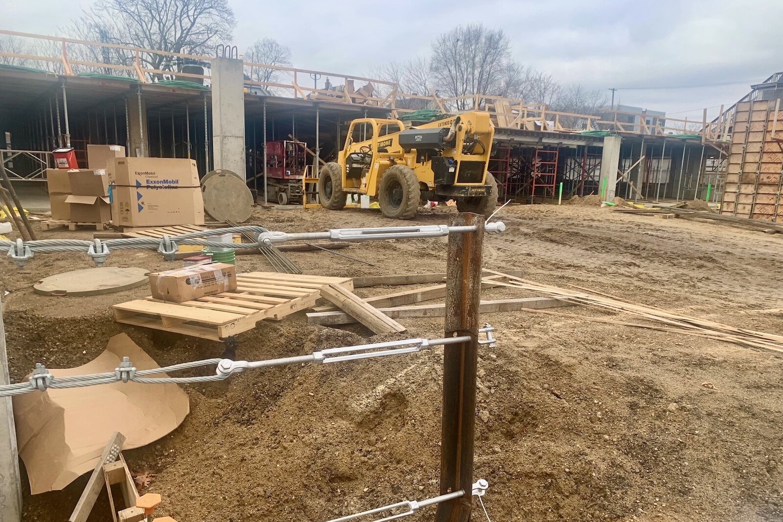 Heavy machinery is helping to convert a former parking lot in the 500 block of South Rose Street into a 64-unit senior housing facility.