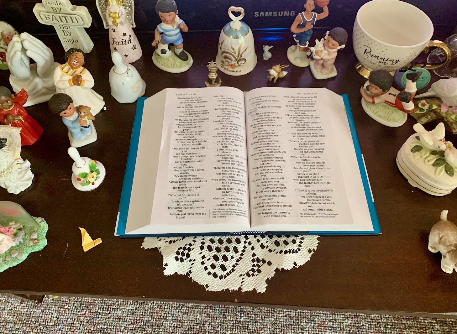 Tiny porcelain figurines surround a Bible that Katherine White has used to pray for her family. She says the young children in her family never disturbed the figurines.
