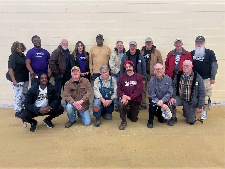 Volunteers with Kalamazoo Valley Habitat for Humanity are shown working  to make internal upgrades at the Douglass Communiy Association.