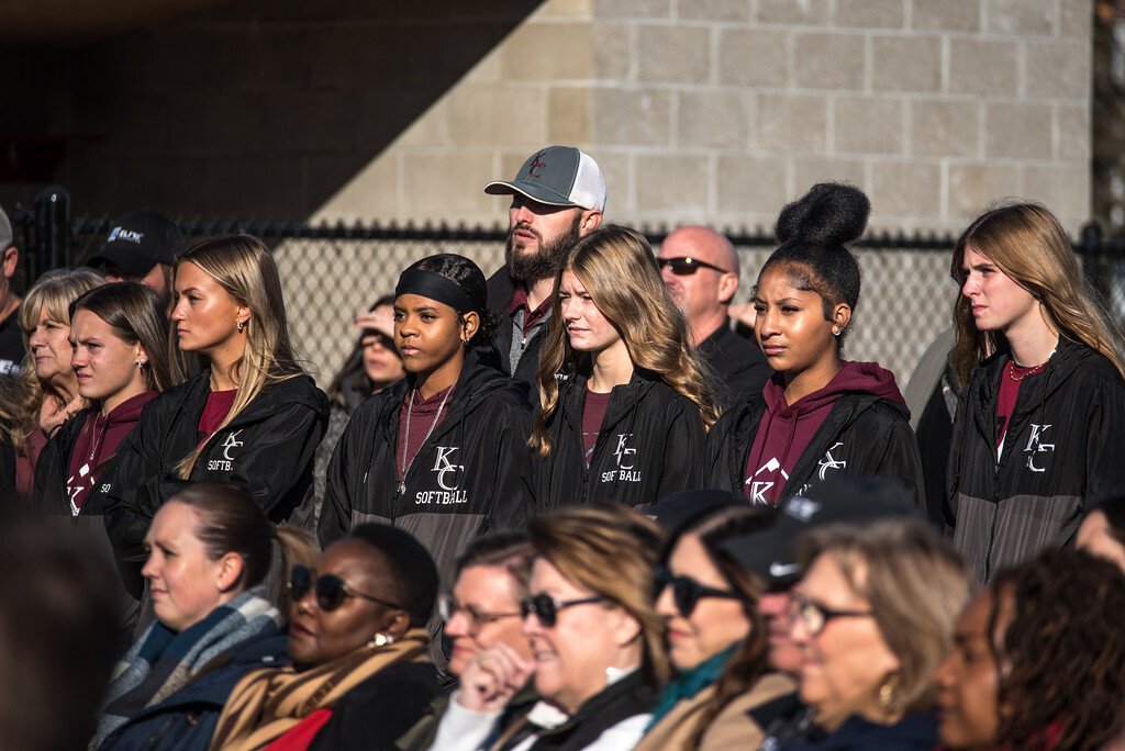 Members of Kalamazoo Central’s softball team were among about 200 people at the Nov. 14 dedication of the school’s new baseball/softball fields. Coach stylus Ratliff is at the rear with cap.
