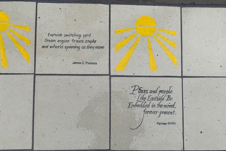 The plaza features d ceramic tiles etched with short poems (called haikus) created by local poet and artist Buddy Hannah based on oral histories from area residents.