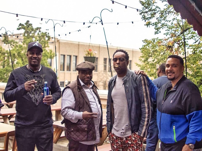  Western Michigan University Alumni catching up on Homecoming Weekend.