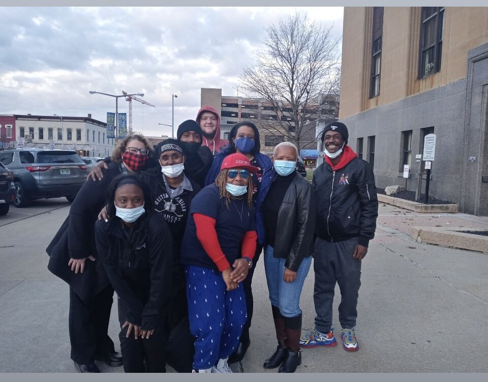 Gun violence victim Montine “Mikey” Wiley is at right as members of ISAAC Group Violence Task Force finishes a visit to the Kalamazoo County Courthouse.