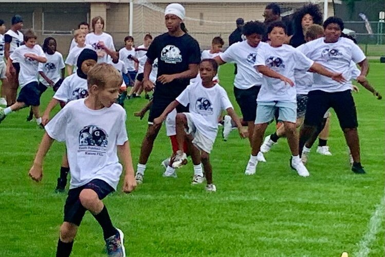 Youngsters from ages 6 to 14 lined up Saturday, Aug. 26, 2025 at Mayor’s Riverfront Park for the first annual Kalamazoo Youth Football Camp. 