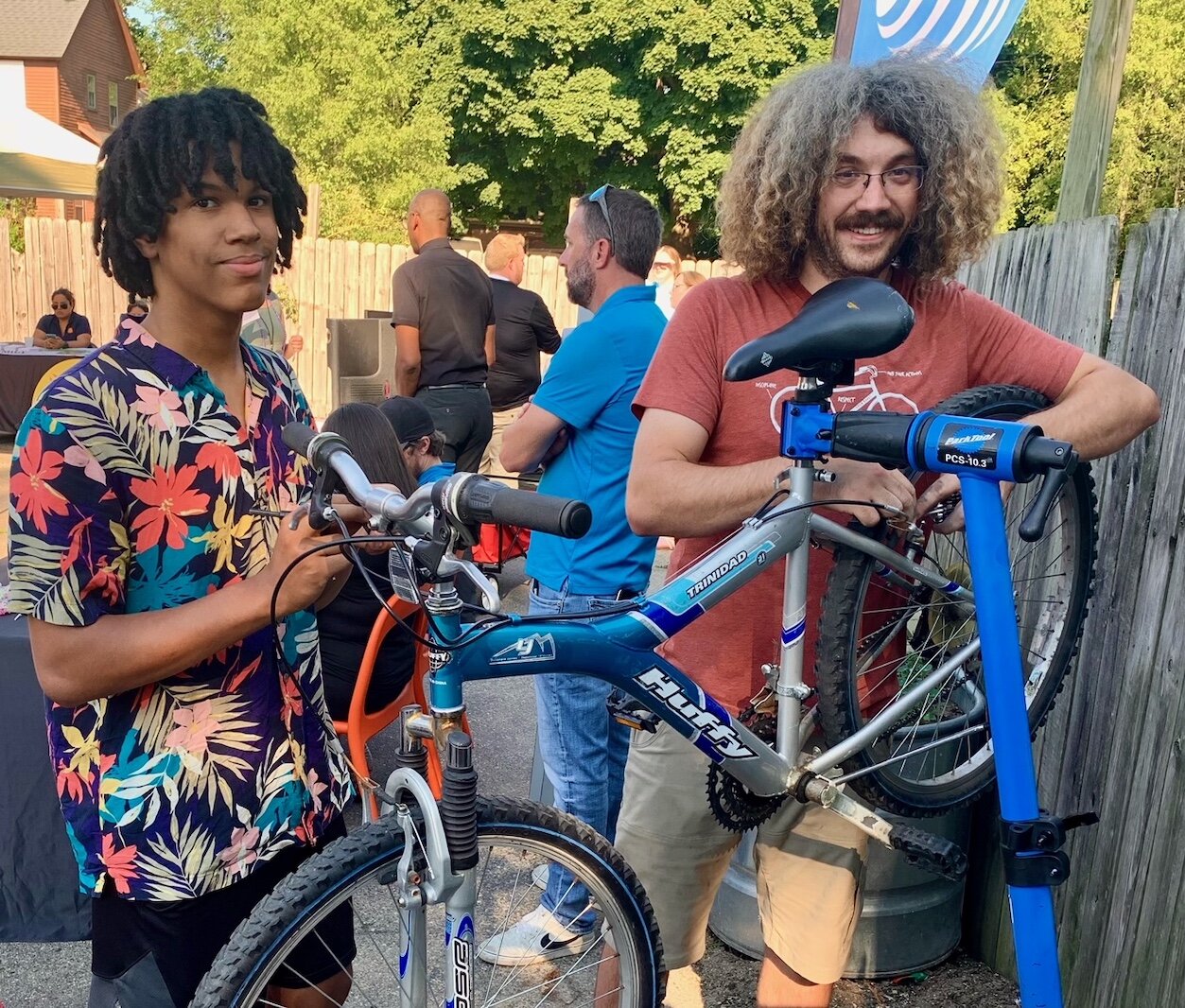 Devin Macharia, left, and Isaac Green, of The Open Roads Bike program, were among representatives of many community organizations to offer information at the Edison Neighborhood’s 2022 National Night Out. Photo by Al Jones