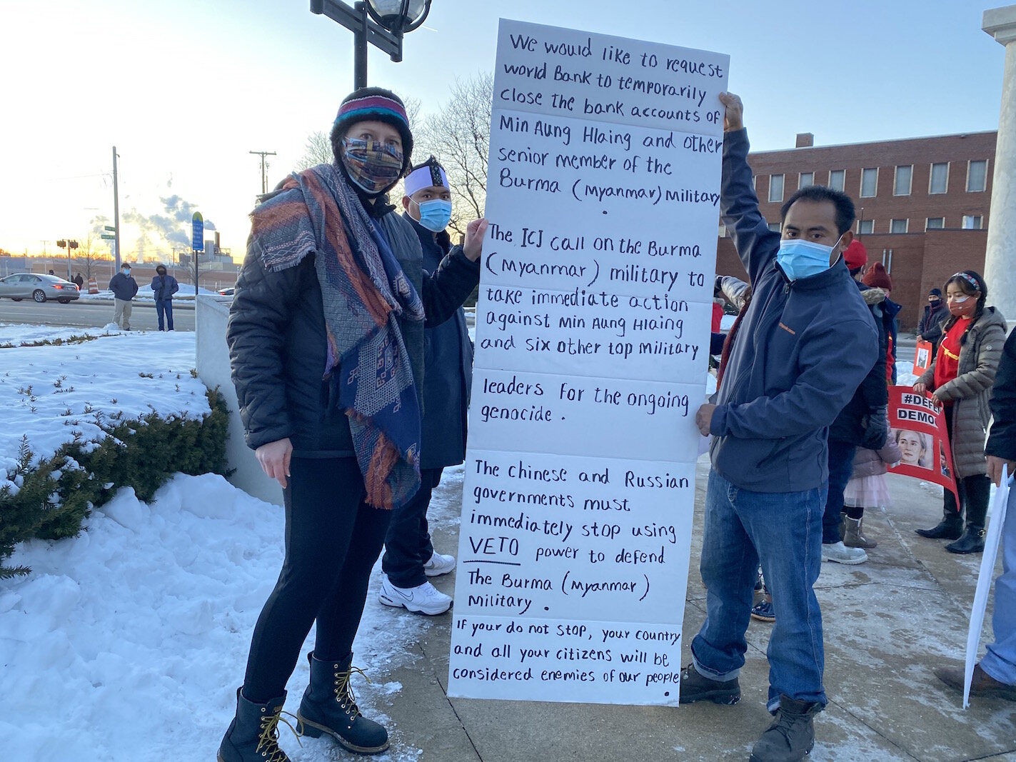Protestors show a list of concerns.