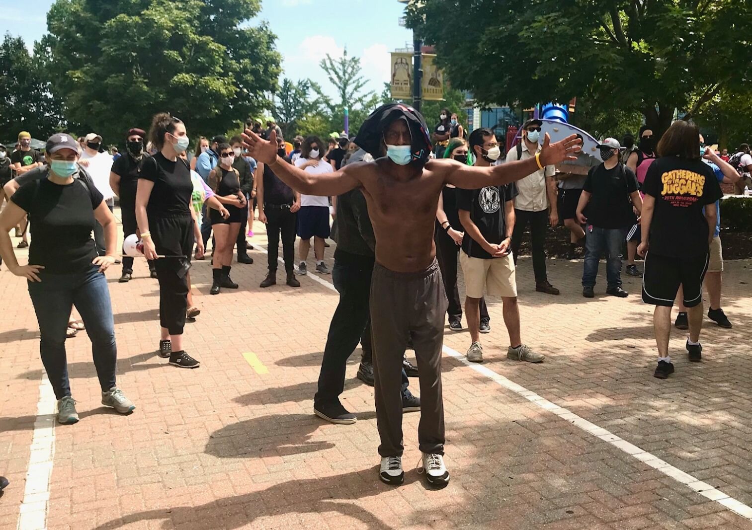 Counter-protesters wait at the eastern entrance of Arcadia Creek Festival Place in downtown Kalamazoo for the arrival of alt-right, now-fascist group the Proud Boys.