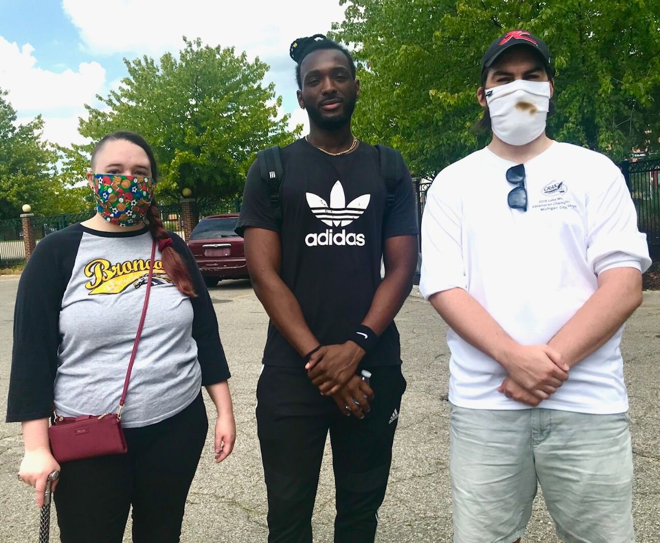 From left are counter-protesters Brianna Mull, Winston Ssessanga and Chad Lenczycki, all of Kalamazoo.