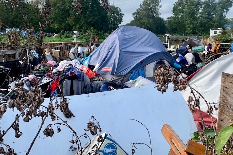 A proposed community of modular housing pods is expected to be a safer alternative to homeless encampments that sprung up near downtown Kalamazoo like this one shown in October of 2021.