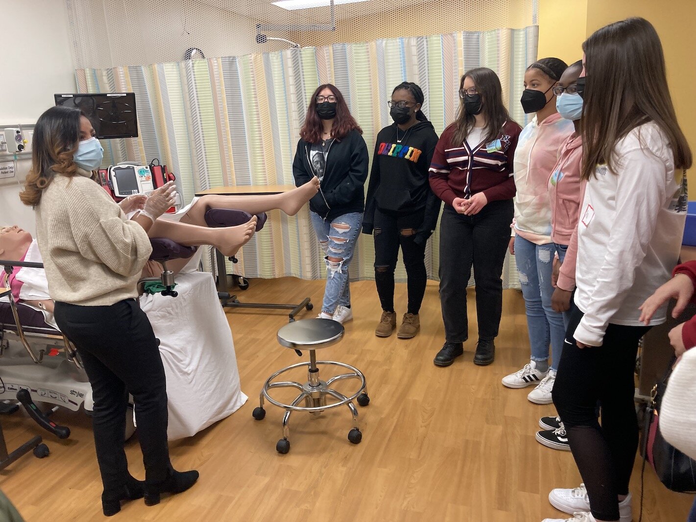 Dr. Diamond Stevens shows a hands-on simulation of how to deliver a baby.